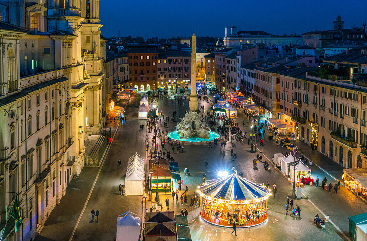 Italian Christmas market at dusk with festive lights, artisanal stalls, seasonal treats, and cultural ambiance.